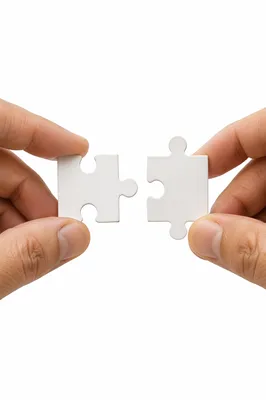 Hands Connecting Puzzle Pieces for Teamwork
