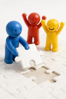 Puzzle Pieces Fitting Together Teamwork Concept
