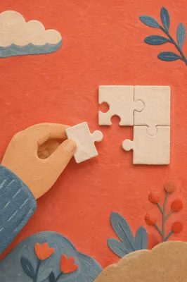 Hand Placing Puzzle Piece for Teamwork