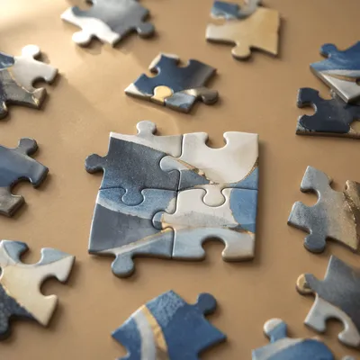 Puzzle Pieces Forming Teamwork and Unity