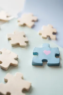 Wooden Puzzle Pieces Symbolizing Teamwork Connection