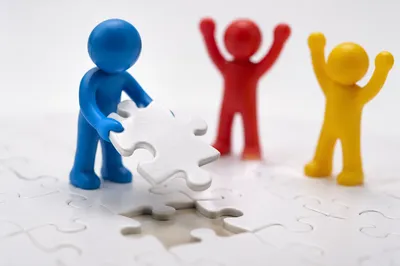 Teamwork Puzzle Pieces Fitting Together Celebration