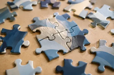 Puzzle Pieces Forming Teamwork and Unity