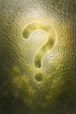 Glowing Question Mark on Misty Glass