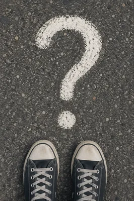 Large Question Mark on Asphalt Path