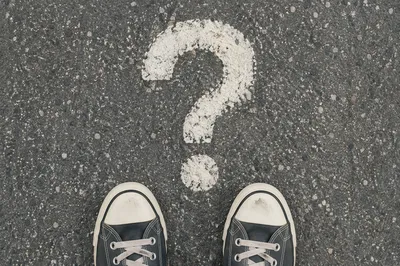 Large Question Mark on Gray Asphalt