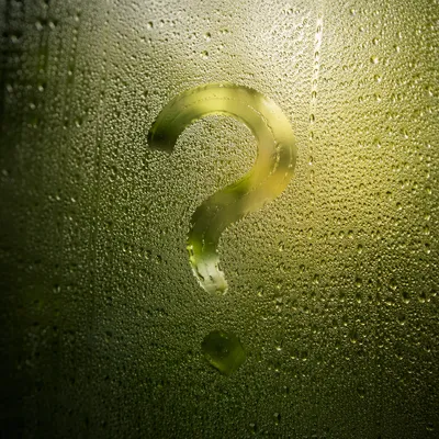 Glowing Question Mark on Misty Glass