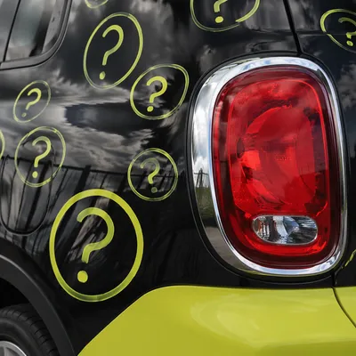 Question Marks on Glossy Car Panel