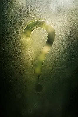 Glowing Question Mark on Misty Glass