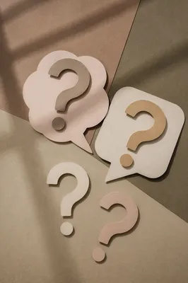 Layered Paper Question Marks on Neutral Background