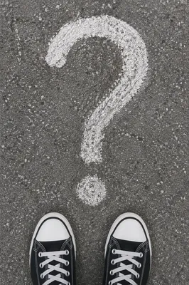 Large Question Mark on Gray Asphalt