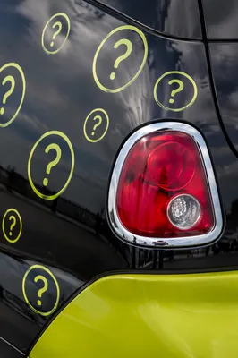 Question Marks on Glossy Car Panel