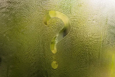 Glowing Question Mark on Misty Glass