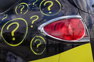 Question Marks on Glossy Car Panel