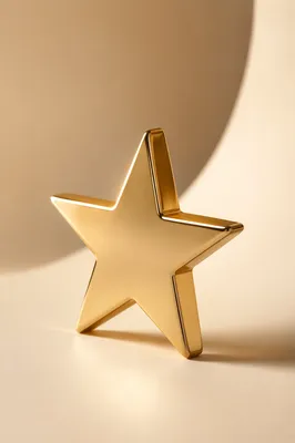 Shiny Gold Star Icon on Cream