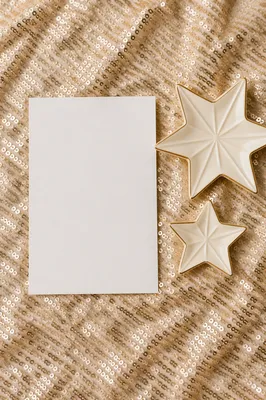 Gold Star Ornaments on Sequin Background