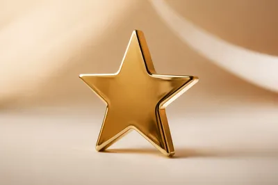 Shiny Gold Star Icon on Cream