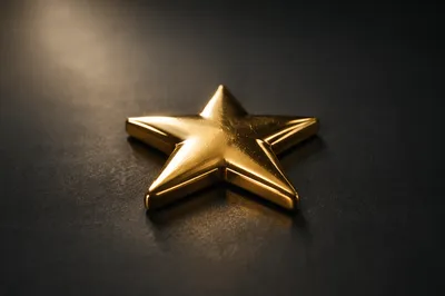 Glossy Gold Star Icon on Charcoal