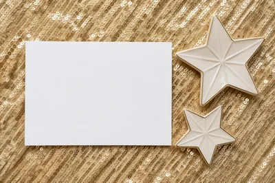 Gold Star Ornaments on Shimmering Background