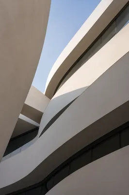 Elegant Modern Facade Curves at Dawn