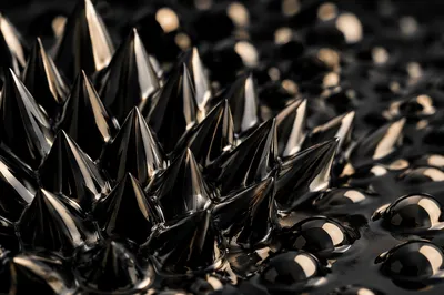 Glossy Black Ferrofluid Spikes Abstract Macro