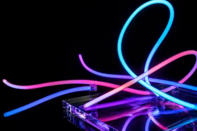 Floating Neon Tubes on Dark Background