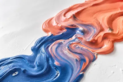 Blue and Coral Paint Swirl Close-Up