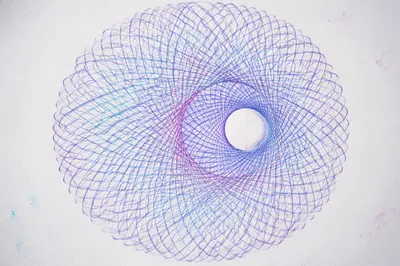 Colorful Spirograph Rosette on White Paper