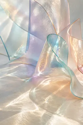 Iridescent Glass Ribbons on Cream Background
