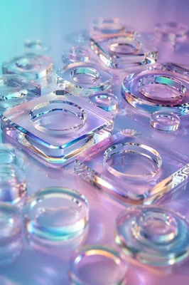 Iridescent Glass Shapes on Pastel Surface