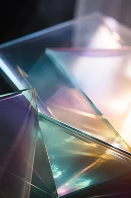 Layered Iridescent Glass Panels in Dark Studio
