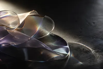 Iridescent Glass Forms on Dark Surface