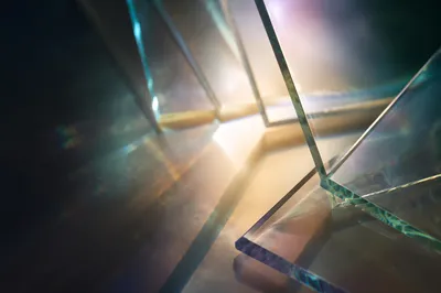 Layered Iridescent Glass Panels in Dark Studio