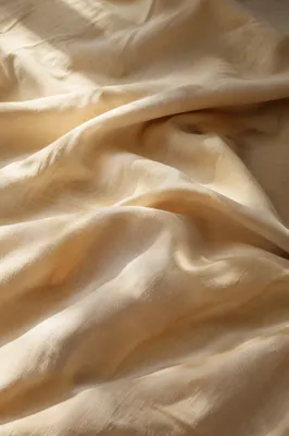 Warm Beige Cream Draped Fabric Background