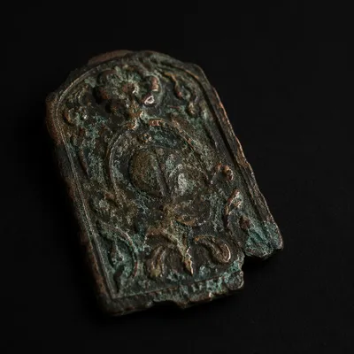 Weathered Bronze Plaque on Black Background