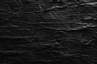 Matte Black Crumpled Texture Background