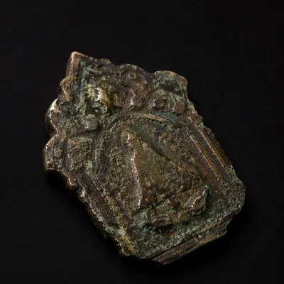 Weathered Bronze Plaque on Black Background