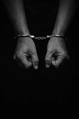 Restrained Hands on Solid Black Background