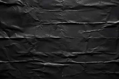 Matte Black Crumpled Paper Texture Background