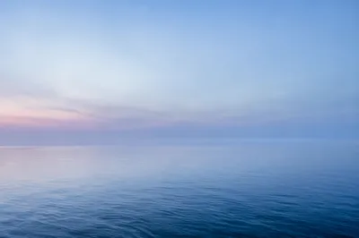 Calm Blue Ocean Horizon at Dawn