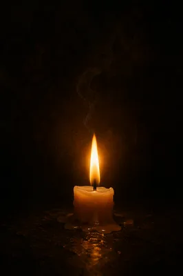 Single Candle Flame in Dark Space