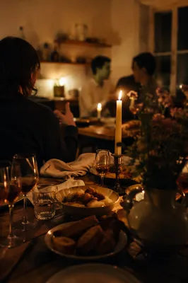 Warm Candlelit Table Gathering Background