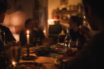Warm Candlelit Table Gathering Background