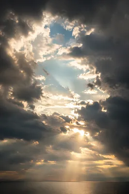 Dramatic Cloudy Sky with Golden Sunbeams