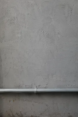 Grey Concrete Wall With Industrial Pipe