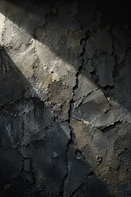Dramatic Light Beam on Cracked Concrete Wall