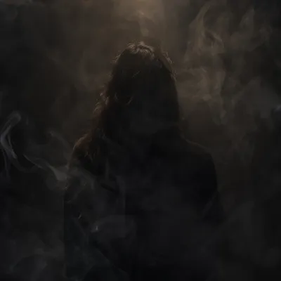 Dramatic Smoky Silhouette in Dark Haze