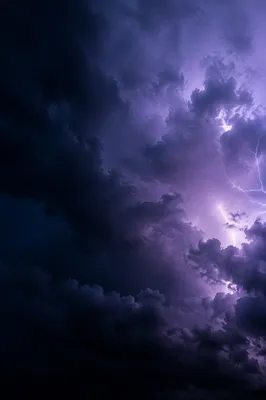 Dark Moody Thunderstorm Clouds With Violet Lightning