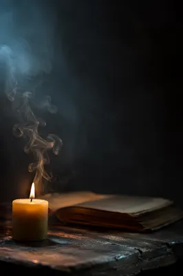 Single Candle with Smoke in Darkness