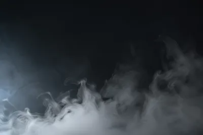Drifting White Smoke on Dark Background